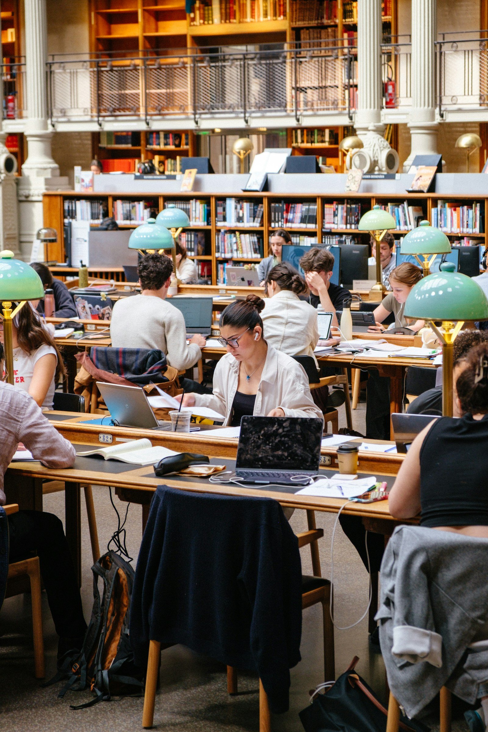 A busy reading room with people studying