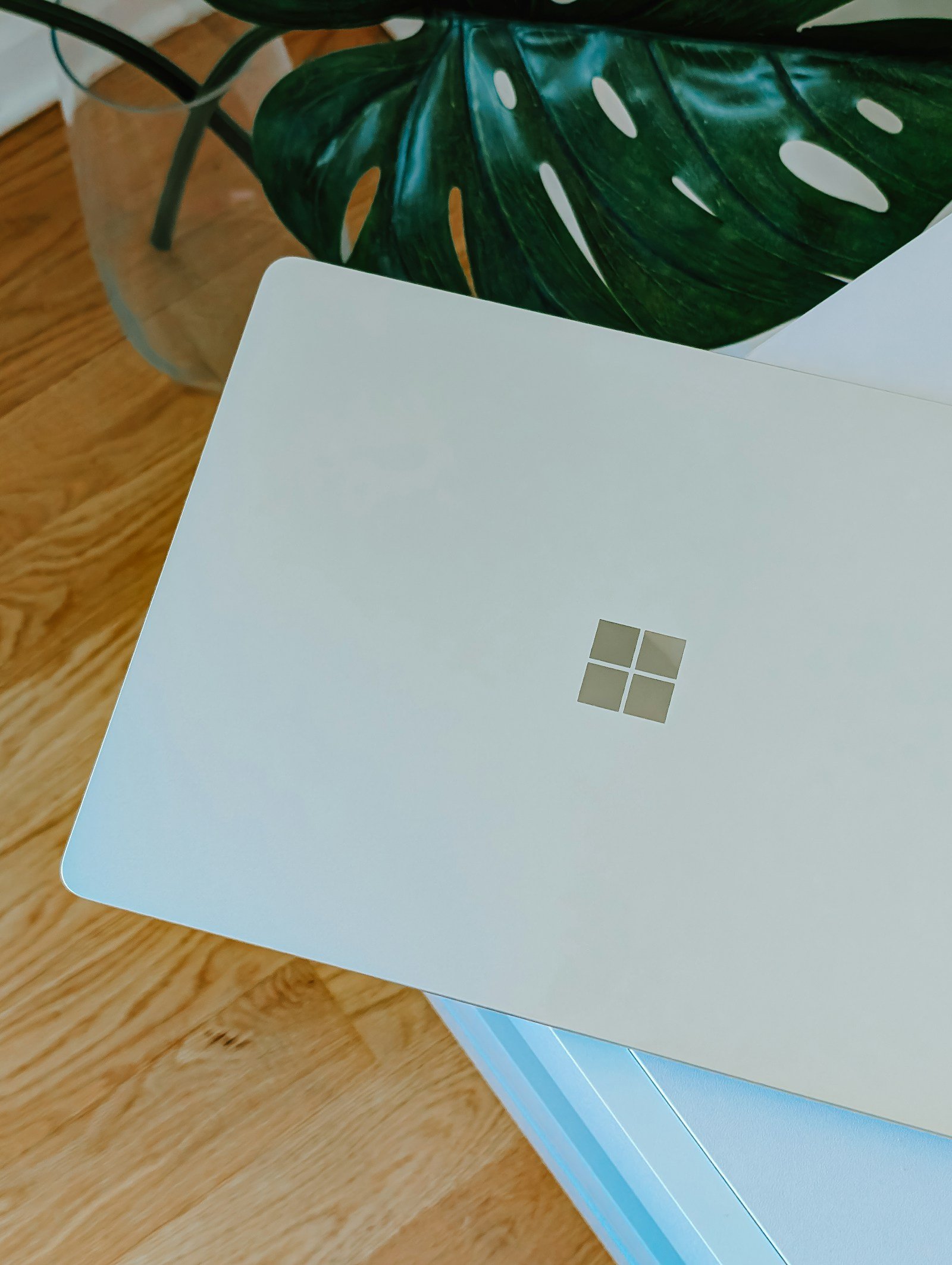 A laptop on a wooden table in a home workspace