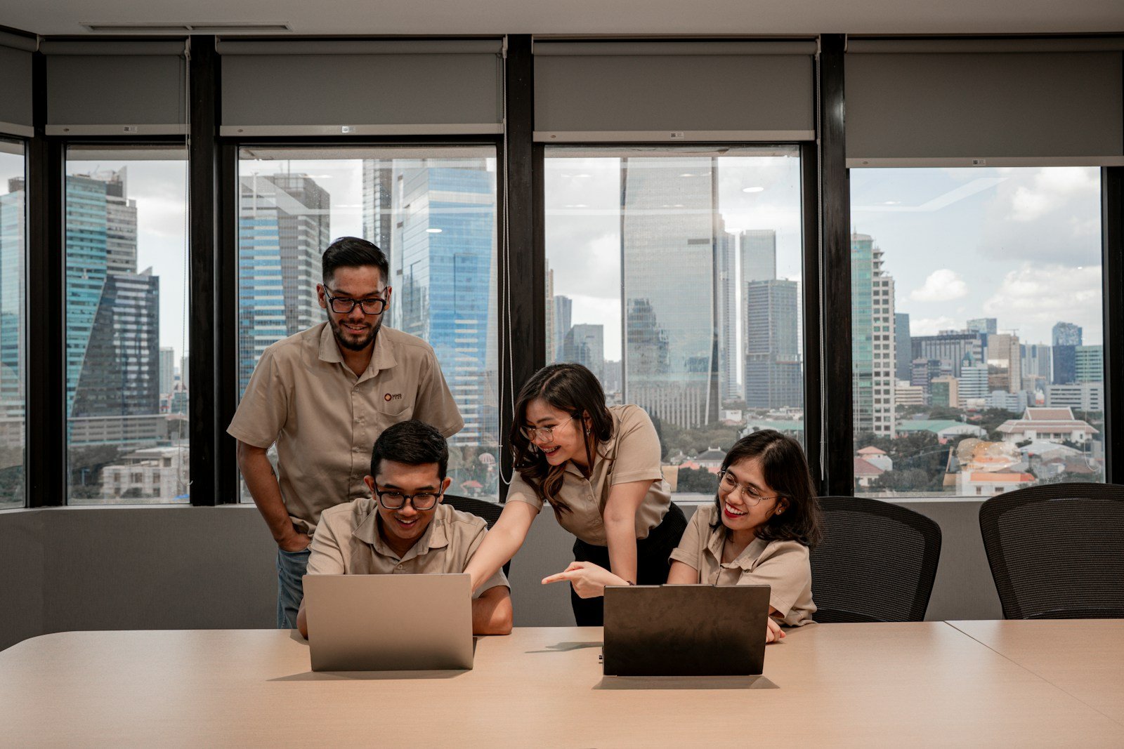 People working together around laptops in a modern office